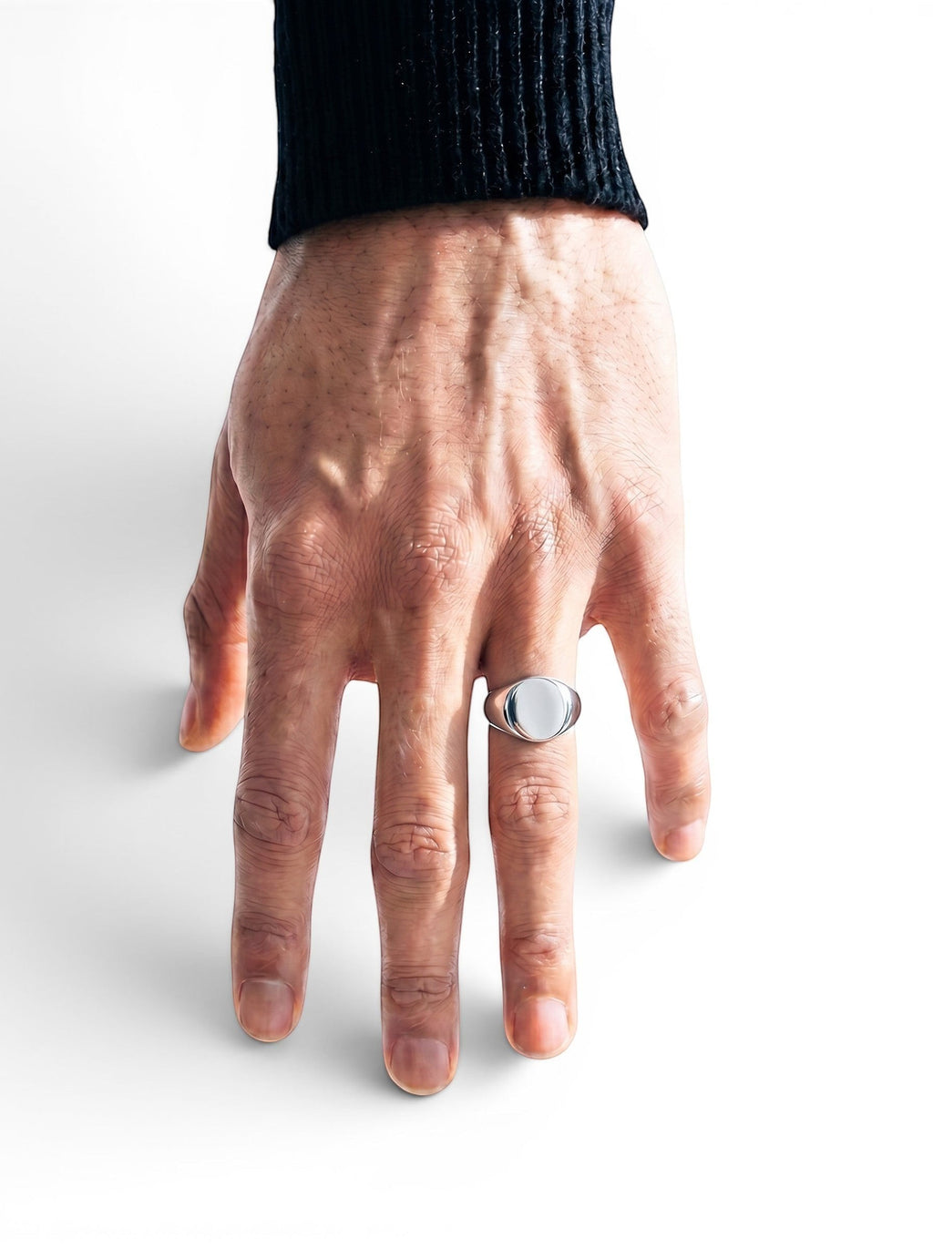AZURO oval signet ring in polished silver, worn on a man's finger. Classic design, available in 3 sizes.